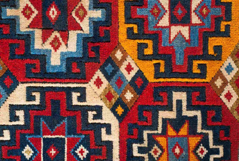 Exploring the Meaning in Turkish and Persian Rug Designs - Vintage Oushak Rug