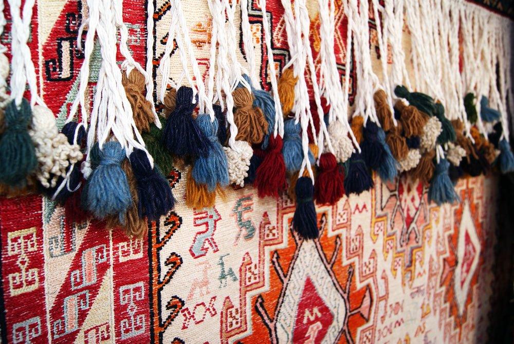 Historical and Cultural Importance of Rugs - Vintage Oushak Rug